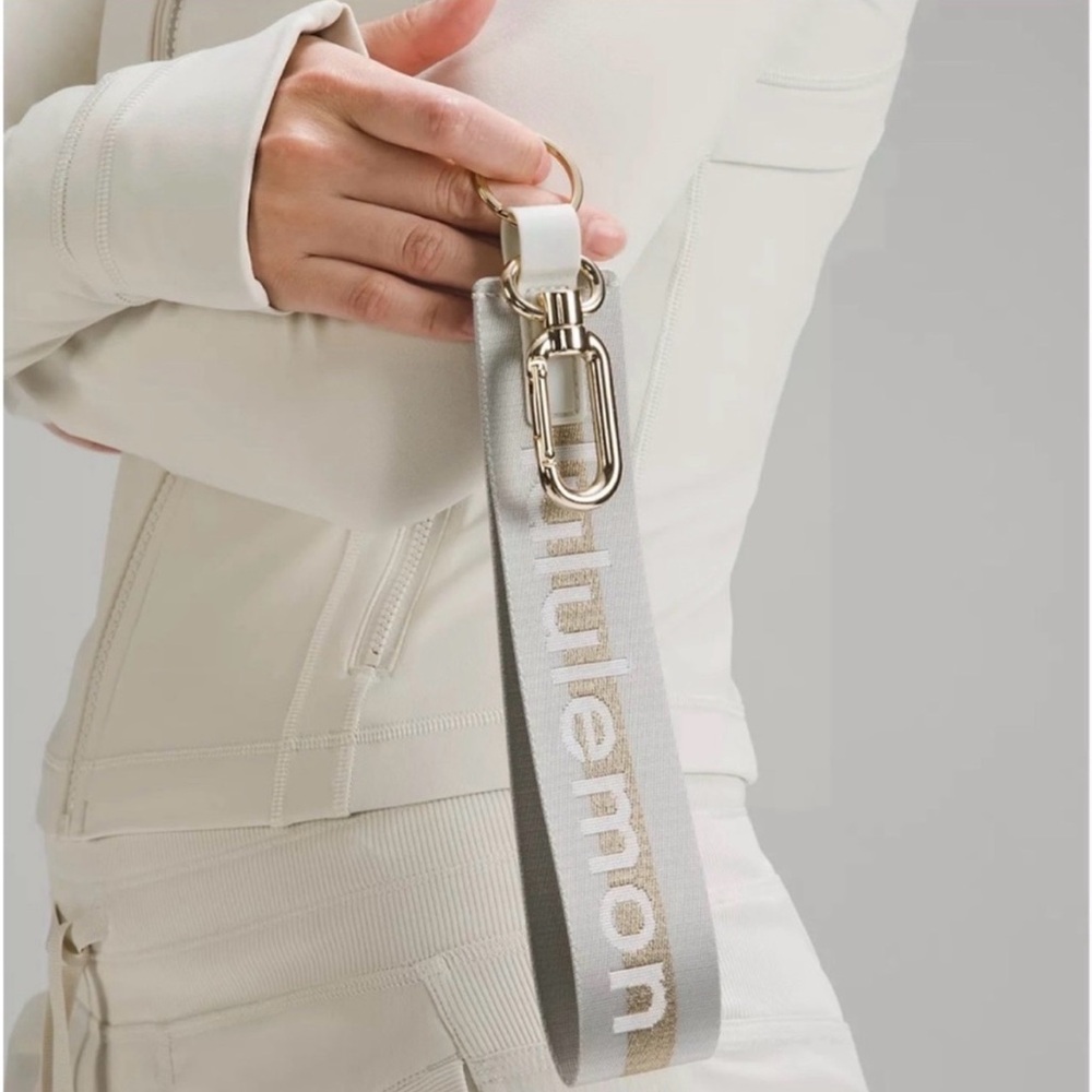 Lululemon Never Lost Keychain Wordmark Vapor and Gold